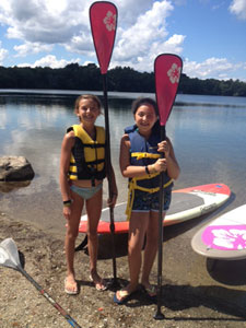 Two friends with paddleboards.